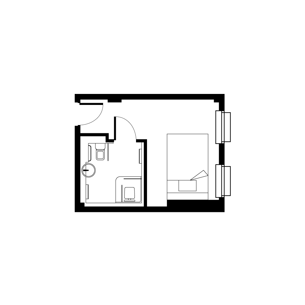Compact and efficient studio apartment floor plan with a spacious bathroom and a cozy sleeping area.