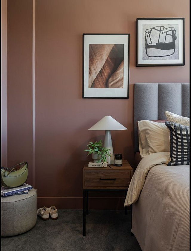 Cozy bedroom with elegant decor, featuring a plush bed and ambient lighting.